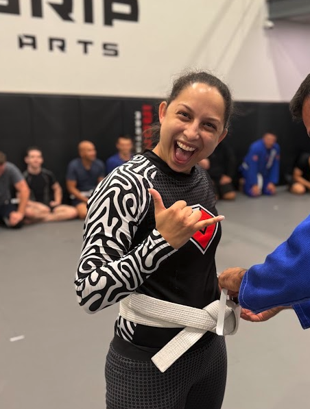 Chanelle Hermans smiling on the Iron Grip training mat